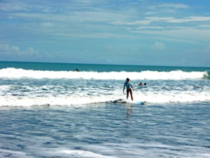 Surfing at low waves in Kuta